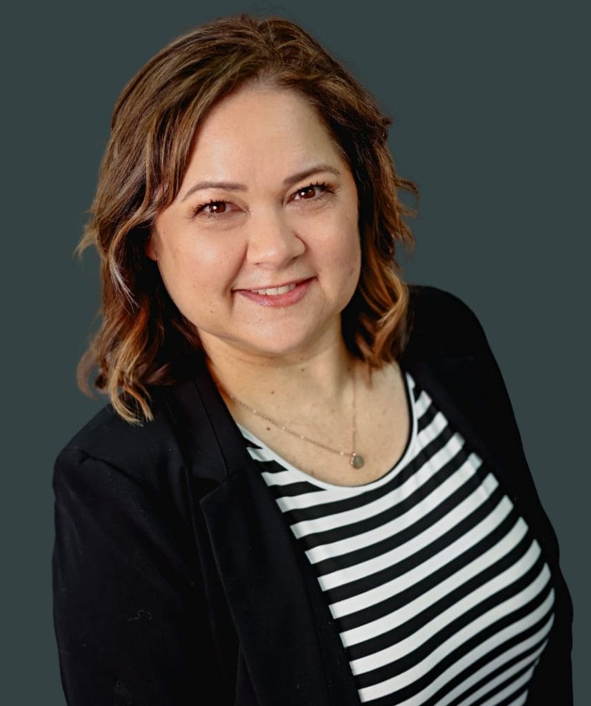 Tami Judd smiling at The Rock Church USA, community leader and church member.
